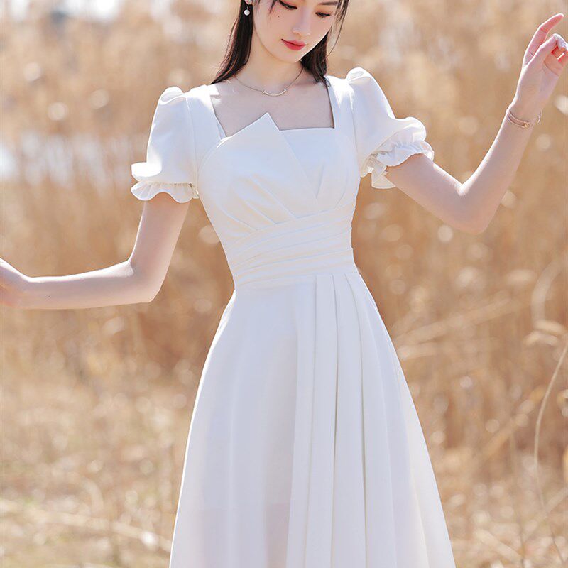 小白裙2024年新款收腰甜美纯欲风白色礼服裙修身显瘦短袖连衣裙女