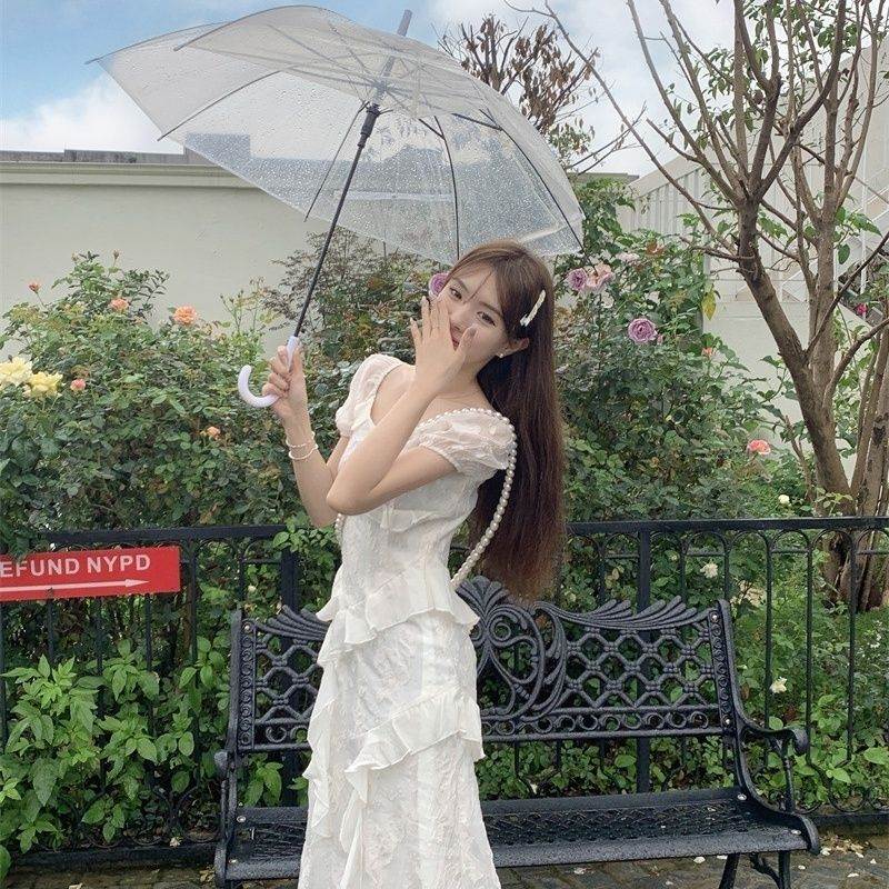 茶歇温柔荷叶边不规则白色连衣裙春季新款桔梗法式仙女公主短裙子