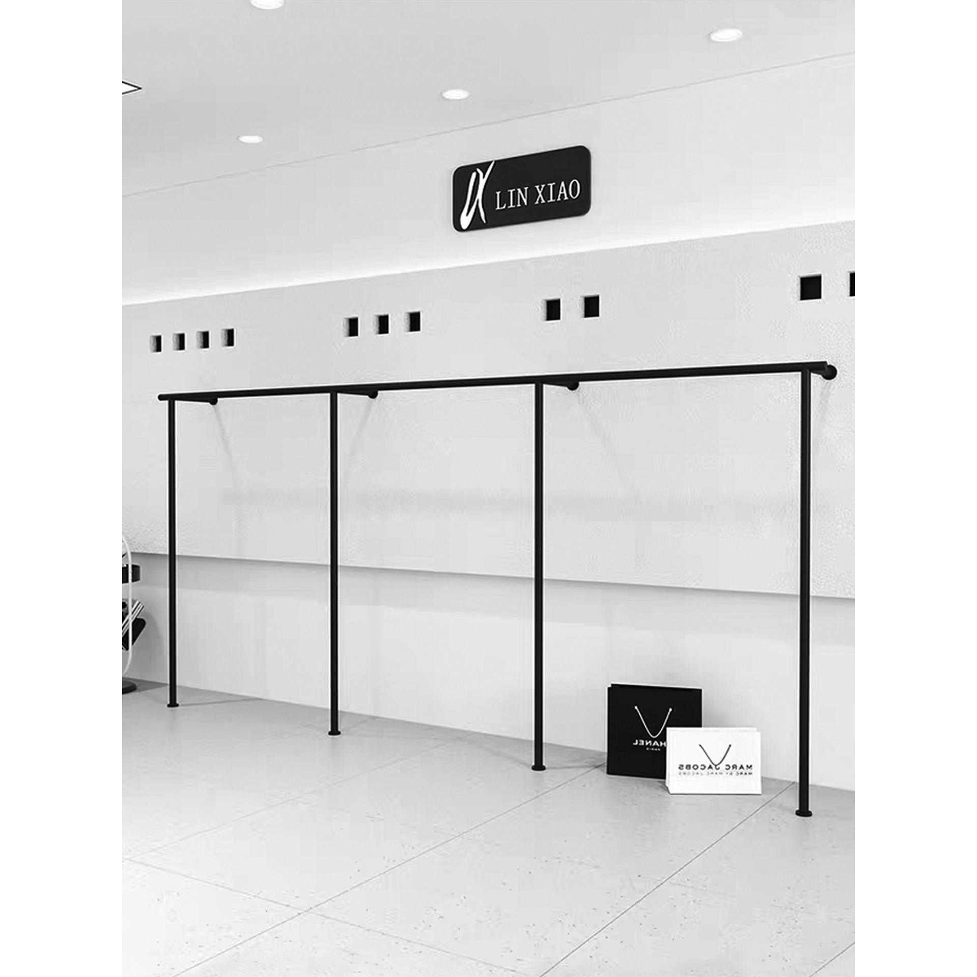 简约服装店展示架上墙壁挂黑色男女装店铺货架陈列道具铁艺挂衣架