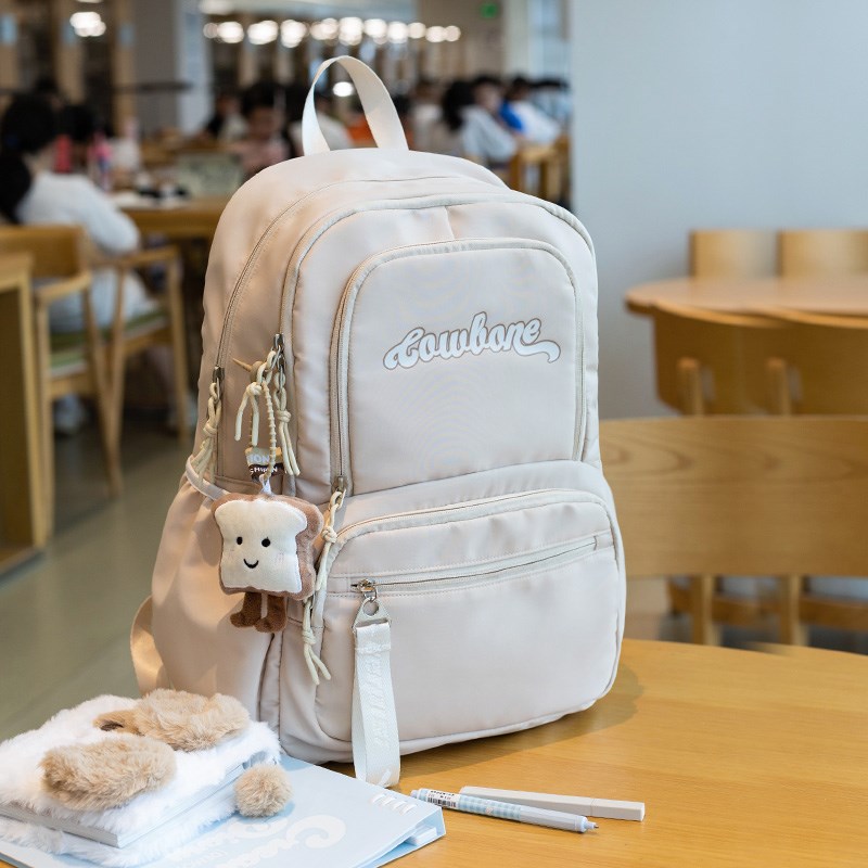 书包初中女生高中大l容量简约小学生4-6年级新款轻便护脊双肩背包