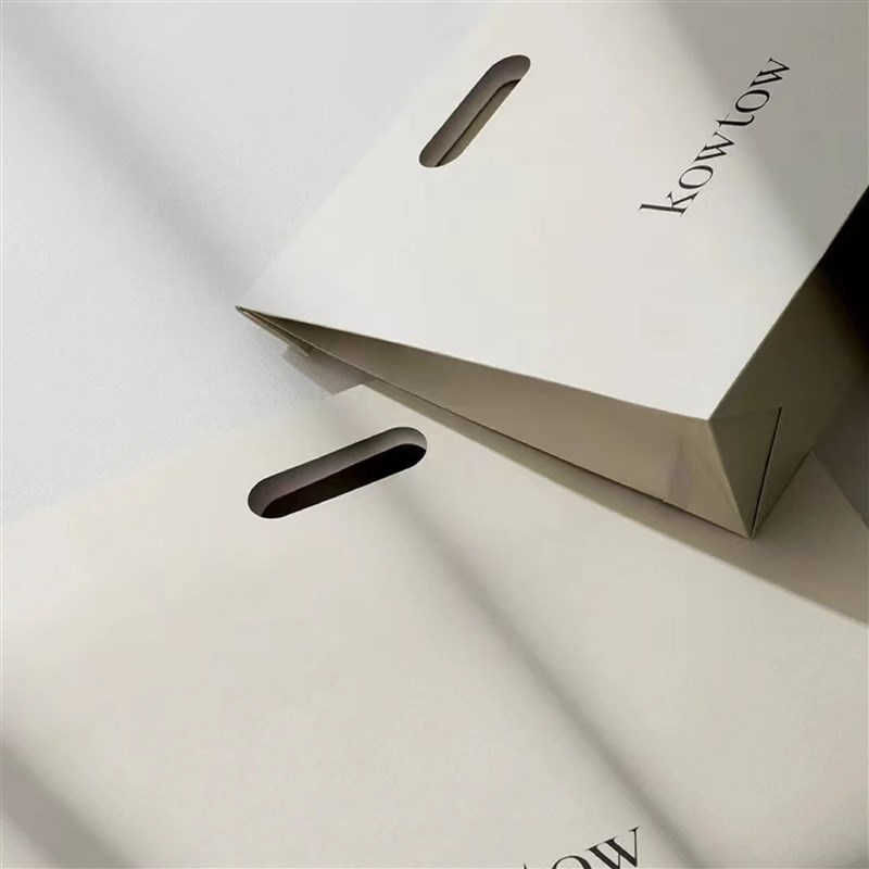 镂空手提纸袋礼品袋手提纸袋定制印刷logo大小服装纸袋定制