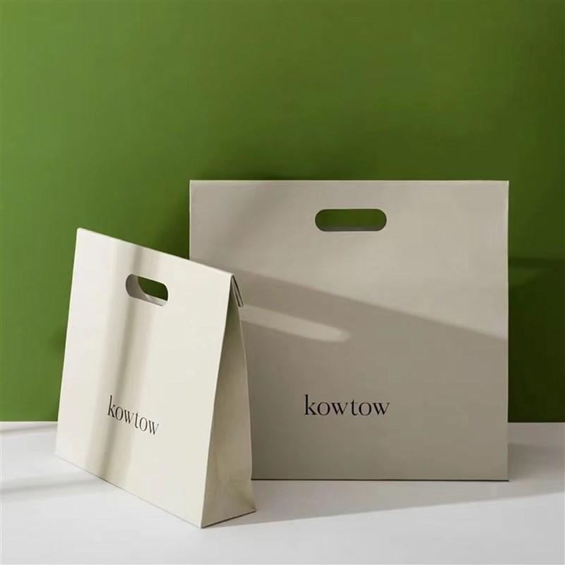镂空手提纸袋礼品袋手提纸袋定制印刷logo大小服装纸袋定制