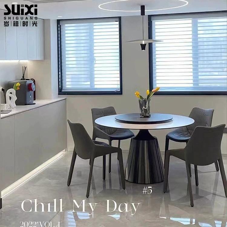 意式极简岩板餐桌现代轻奢家用圆形餐桌不锈钢黑钛高端餐厅饭桌