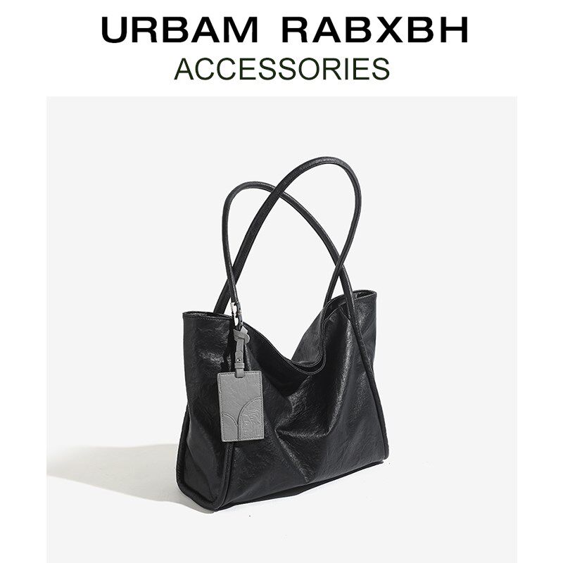 小众设计真皮黑色大容量托特包女2025新款春季通勤单肩包腋下大包