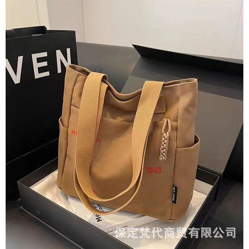 帆布包卡通d字母手提包便当包妈咪包溜娃袋手提母婴包学生通勤包