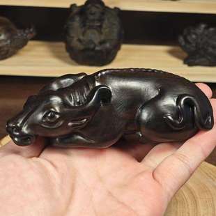 11公分印尼达拉干木牛转乾坤文玩手把件生肖牛实木工艺品摆件