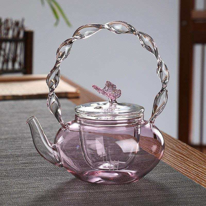粉色扭扭把壶厂家供应高硼硅玻璃提梁茶壶电陶炉加热蝴蝶壶茶具