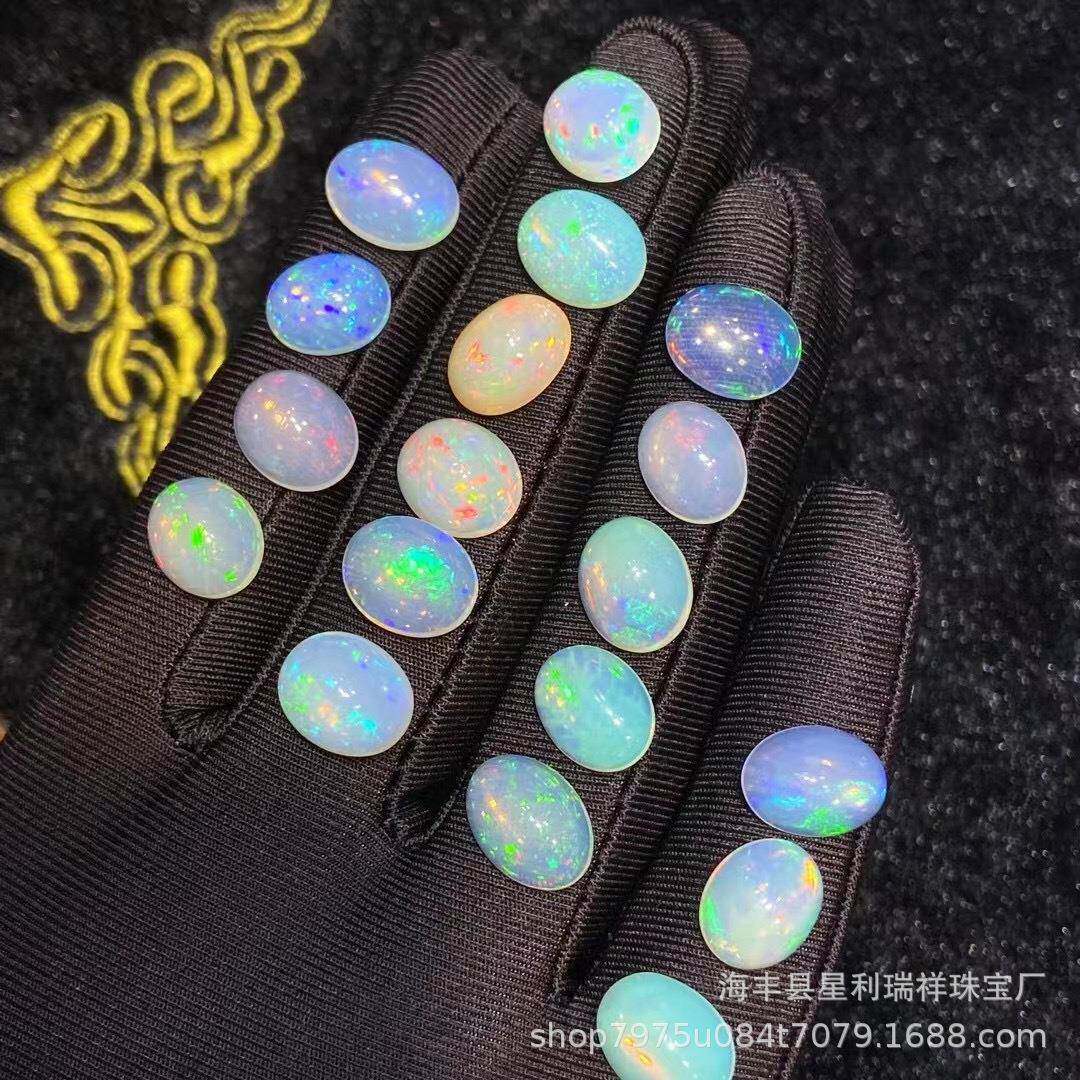 天然欧泊椭圆形戒面澳宝裸石祖母绿彩虹色闪艳满火彩石体白欧泊
