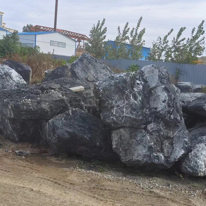黑山石置石石蛋园林绿化原石厂家买卖景观河道景石造景黑色置石