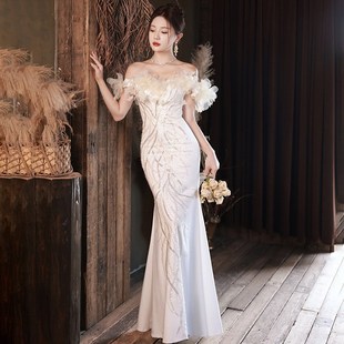 一字肩晚礼服2024新款欧美端轻奢连衣裙亮片鱼尾主持人白色礼服明
