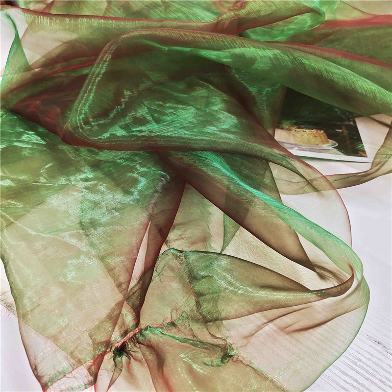 色幻彩镭射丝光欧根纱布料 设计师创意面料礼服汉服舞蹈摄影纱