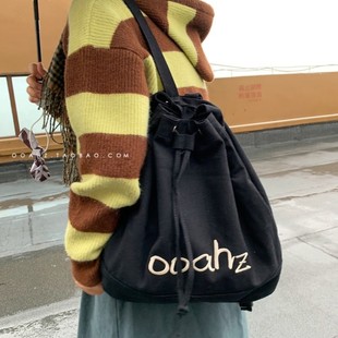 逃不掉黑白抽绳字母 ooahz自制刺绣帆布背包大容量学生水桶包包