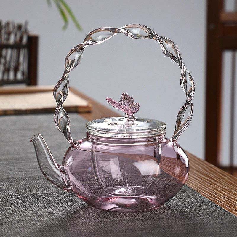 粉色扭扭把壶厂家供应高硼硅玻璃提梁茶壶电陶炉加热蝴蝶壶茶具