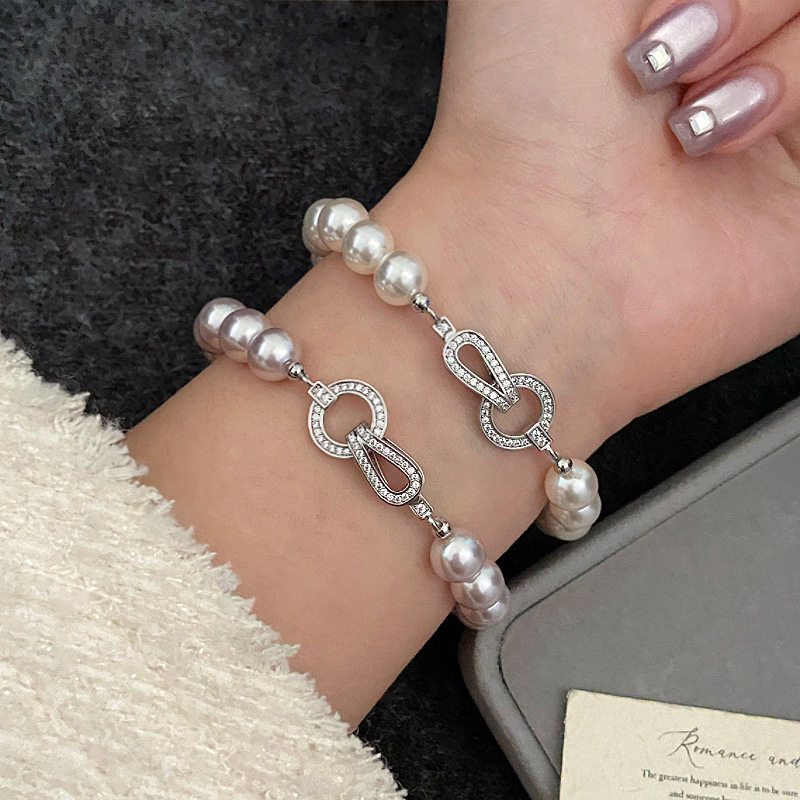 曼塔玫瑰施家珍珠OT扣正圆微镶