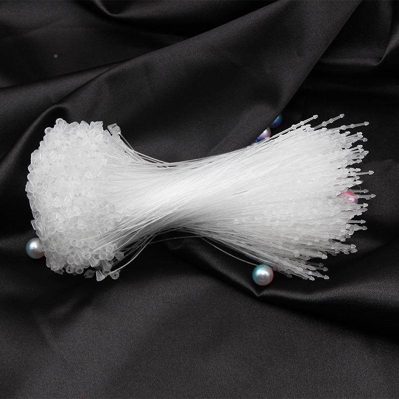 飞中手穿针母扣衣服商标牌线吊牌NZD挂绳塑扣吊牌吊扣服装吊子料