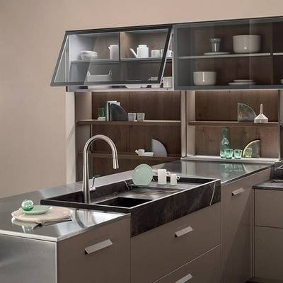 Modern style cabinets with flip-up Blum hinges and quartz co