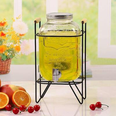 The glass jug bucket with tap water dispenser glass juice