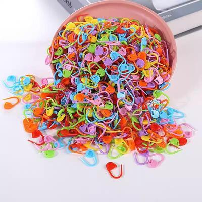 Colorful hand-woven tool accessories: plastic markers, sewin