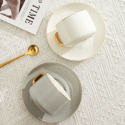 Classic ceramic coffee cup with gold handle creative design