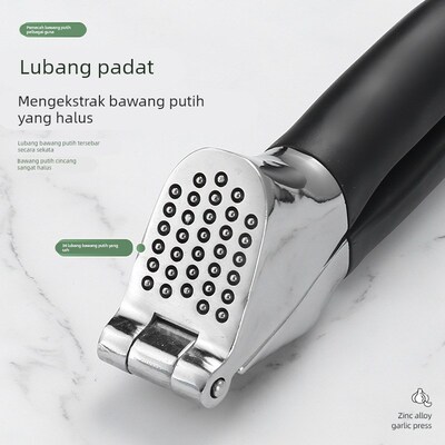 Zinc alloy manual garlic press, thickened for household use.