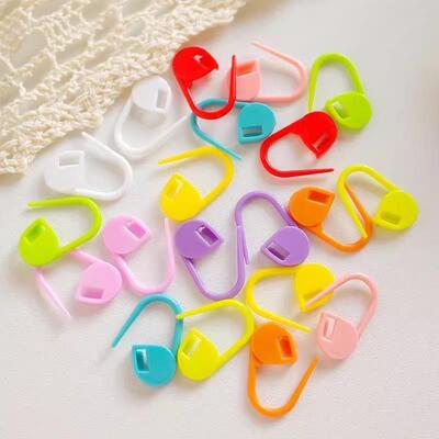 Colorful hand-woven tool accessories: plastic markers, sewin