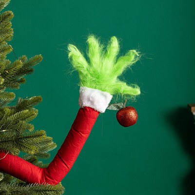 Christmas decorations, funny Grinch arms, Christmas tree pe