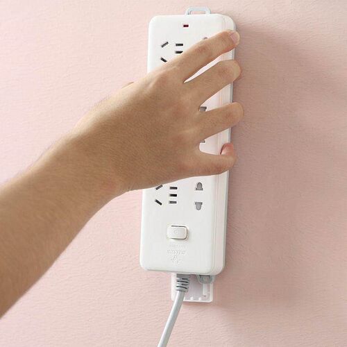 Wall-mounted power strip holder, no-drill adhesive cable man