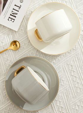 Classic ceramic coffee cup with gold handle creative design