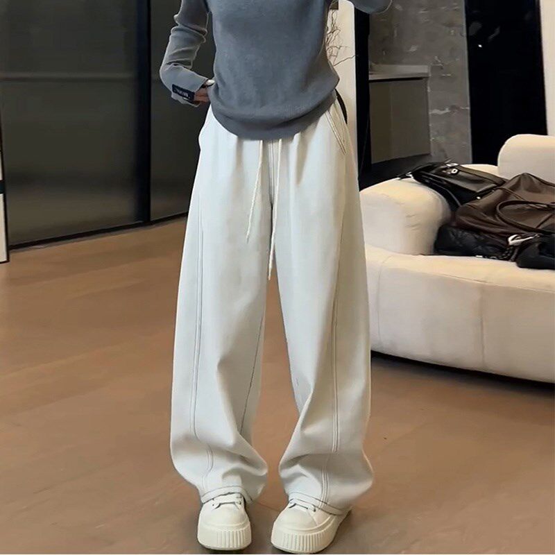 春季百搭牛仔裤女2025春款新款松紧腰简约休闲风弯刀显瘦长裤子