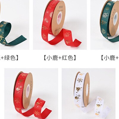 Christmas-themed gold-embossed satin ribbon gift accessory.