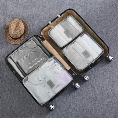 Travel storage bag divided into clothing pocket storage bag