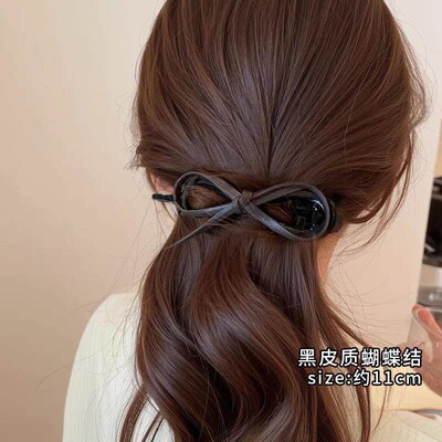 Leather bow twist clip, exuding elegance and sophistication