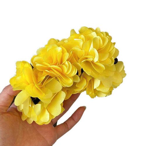 The bloggers matching flower-back-of-the-head style, featur