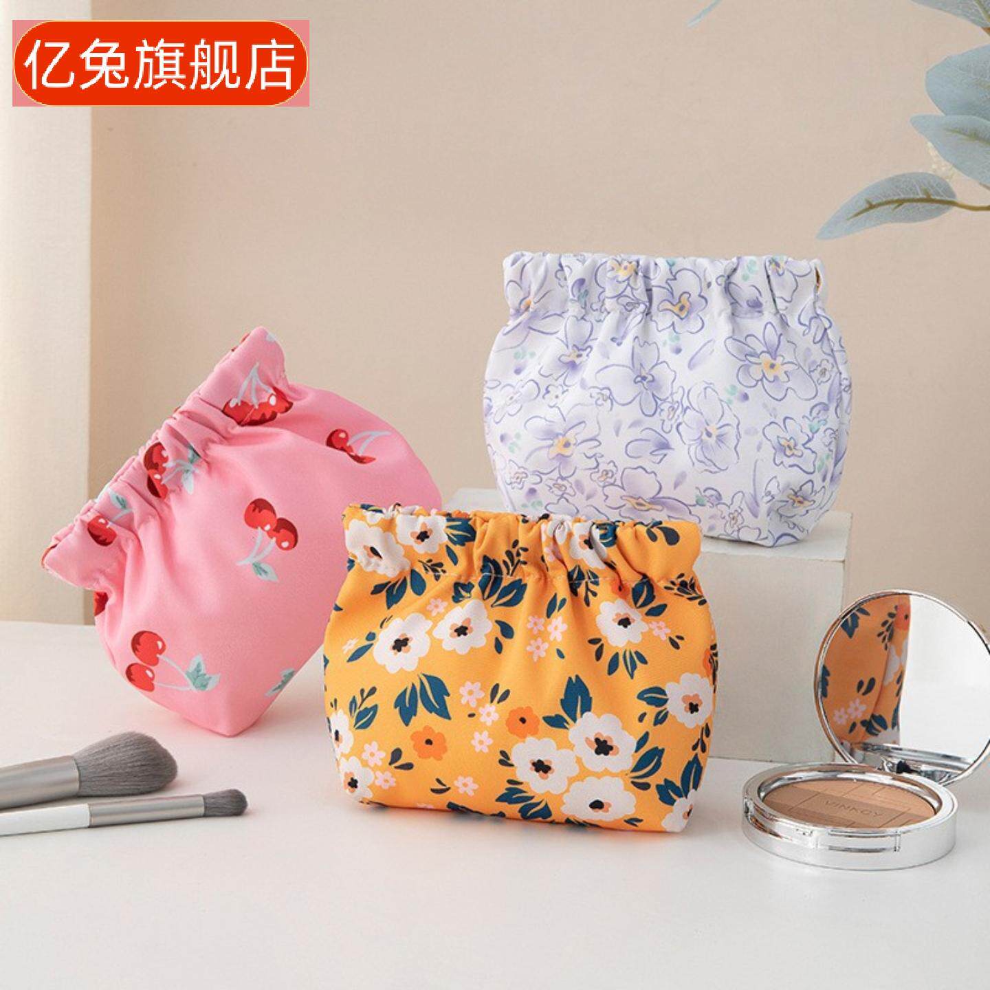女士口红收纳包弹片自动闭合印花