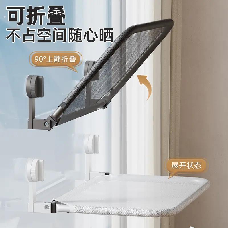 粘在玻璃上的置物架吸盘折叠晾衣架晾晒网室内晒袜子阳台空间利用图片