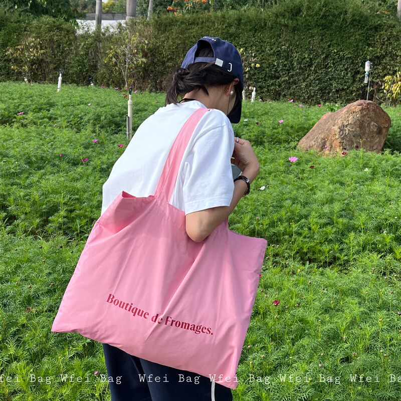春夏薄款通勤大容量帆布袋多巴胺简约小众百搭粉色单肩包手提包女