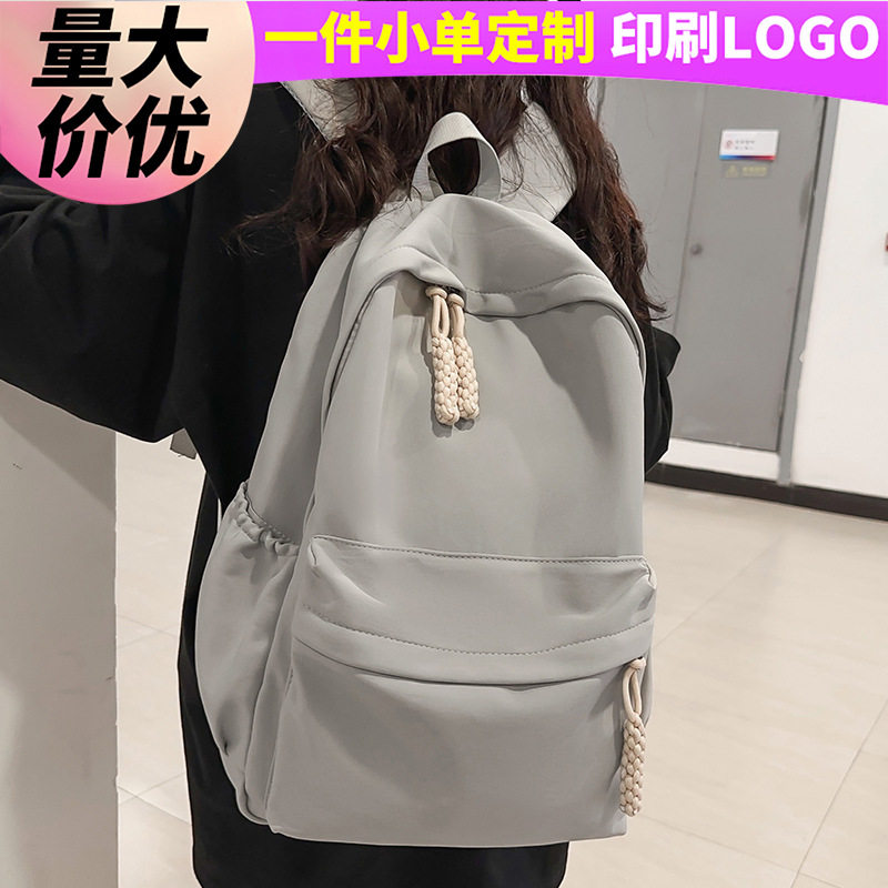 儿童书包小学生6-12岁女孩初高中生男孩纯色背包定制批发双肩包包