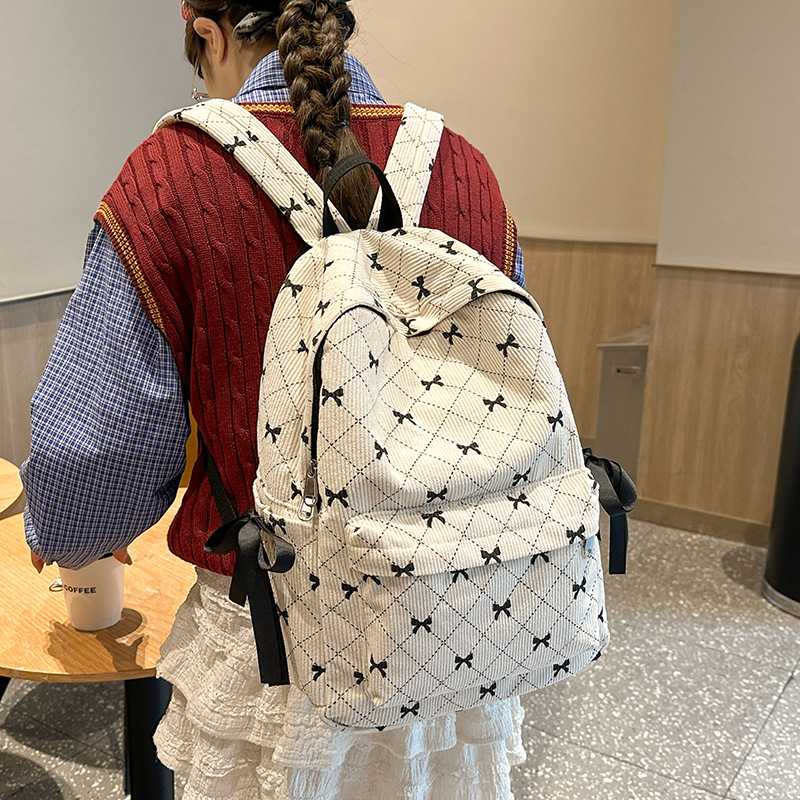 可爱书包女大学生时尚蝴蝶结双肩包日系百搭初中生旅行电脑背包潮