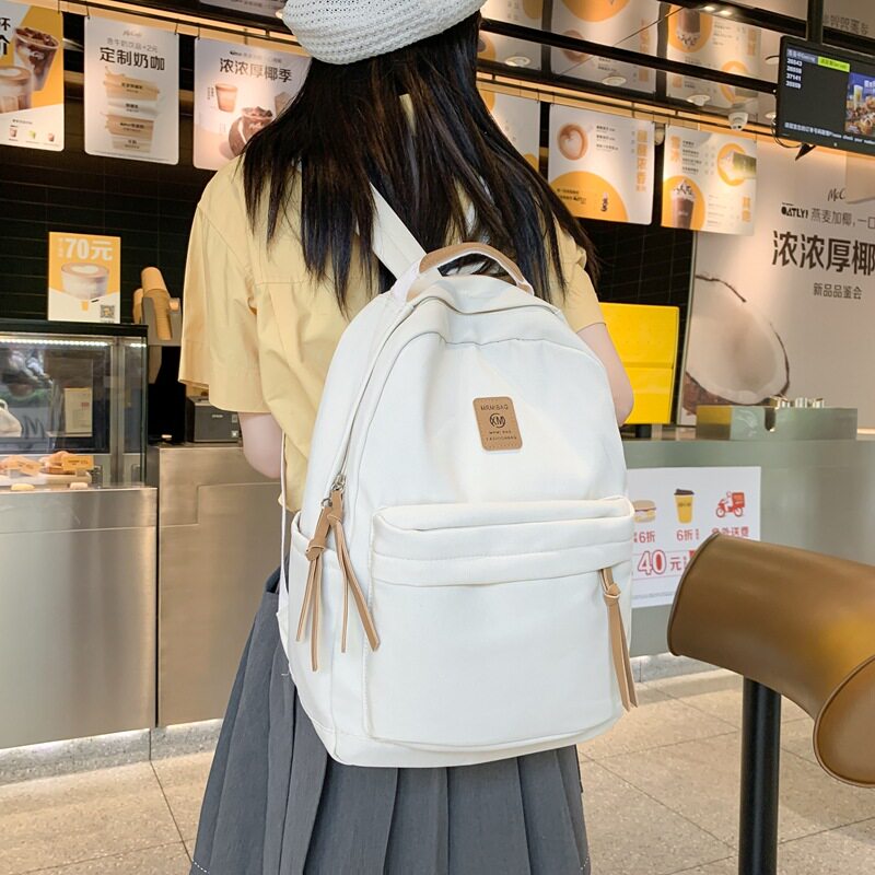日系双肩包女士休闲校园高中生大学生书包男原创小众简约旅行背包