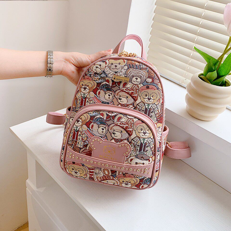 2026新款双肩包女包韩版时尚书包百搭卡通小熊帆布包休闲旅行背包