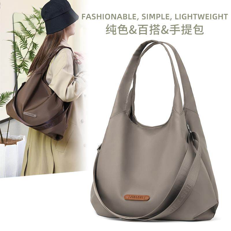 2024新款时尚百搭单肩斜挎手拎包女简约休闲包女士上班通勤饺子包