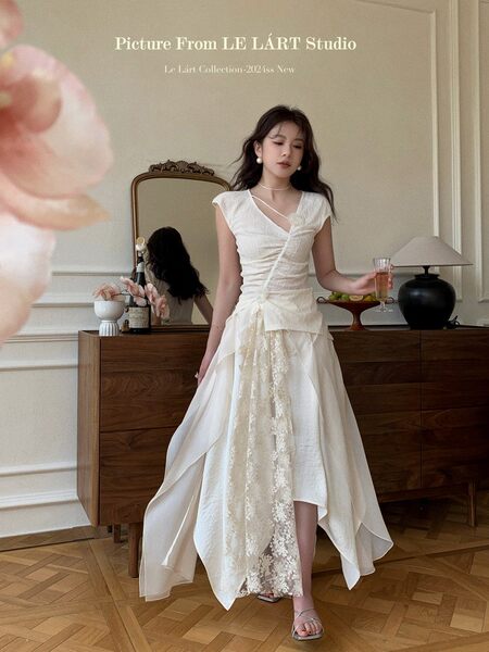 Woman wearing a white elegant long dress indoors