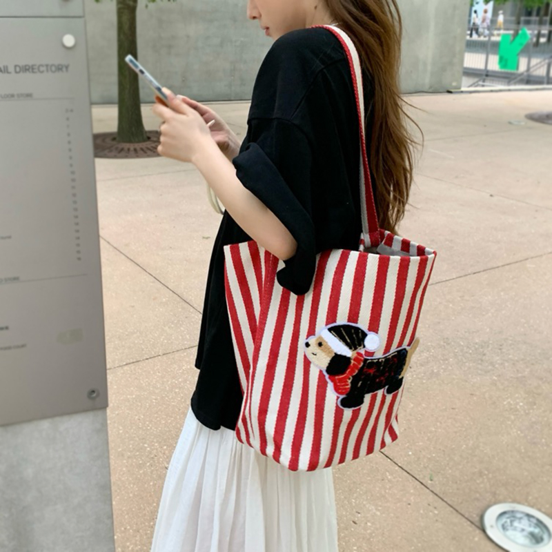 时尚条纹帆布包2024新款休闲慵懒风单肩包水桶包大容量托特包女包