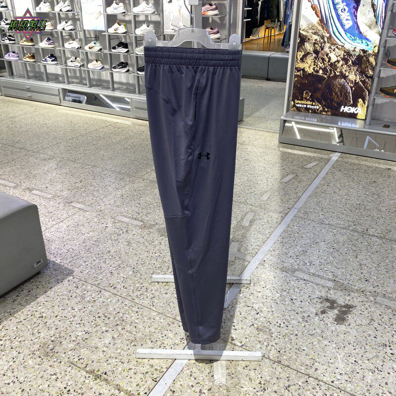 新款队正品UA安德玛简约LOGO收腿训练百搭男女运动休闲梭织长裤