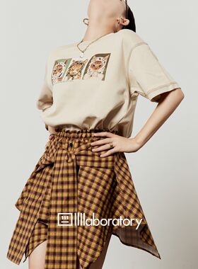 黄色半身裙女2026新款松紧腰格子不规则百搭设计感高腰短裙