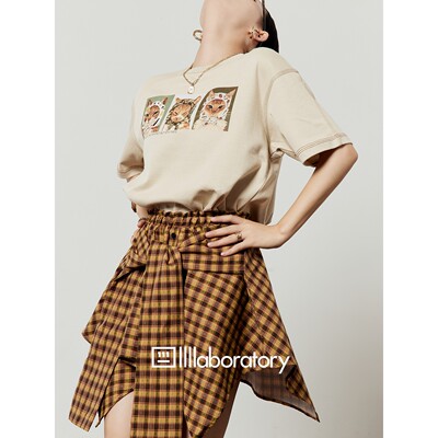 黄色半身裙女2025新款松紧腰格子不规则百搭设计感高腰短裙