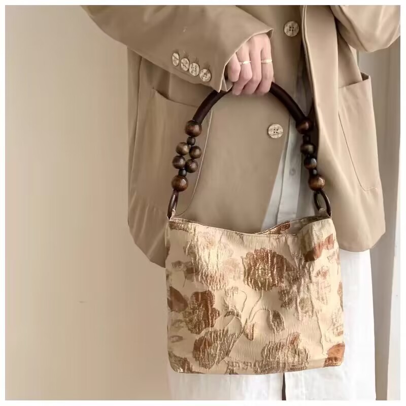 原创焦糖玛奇朵复古提花布艺单肩包夏季新款手提包刺绣水桶包