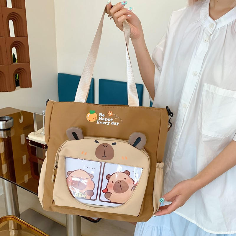 卡皮巴拉小学生斜挎包帆布包卡通手提袋女孩初中生单肩背包补习袋