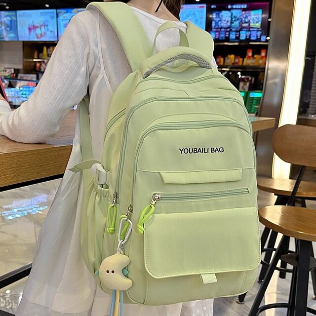 绿色双肩书包女大容量轻便减负初中生高中生韩版字母背包2025新款