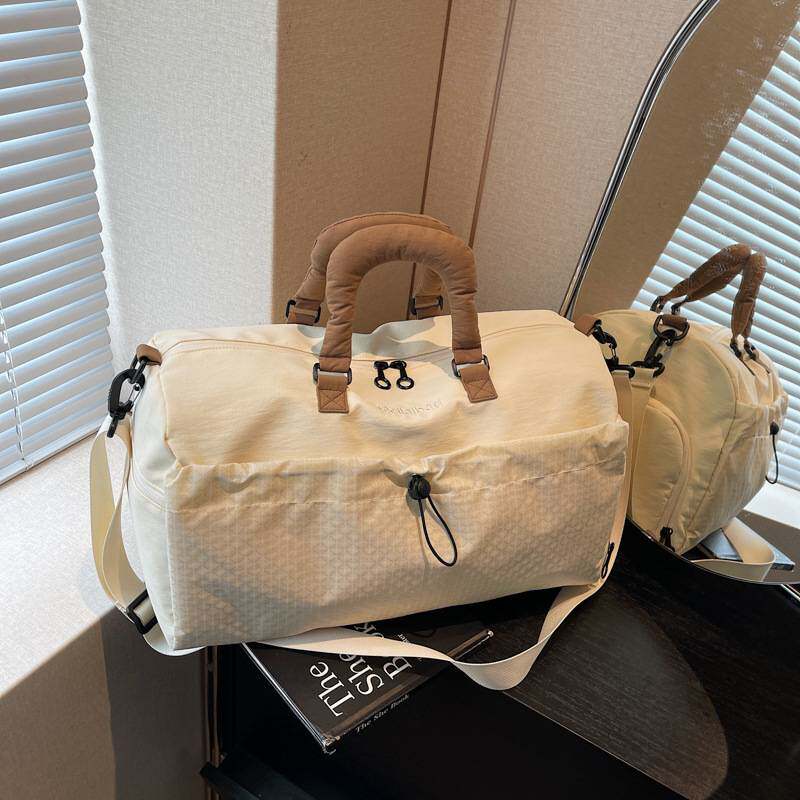 商场品牌大容量旅行包女时尚轻便手提斜挎运动健身包男短途旅游收
